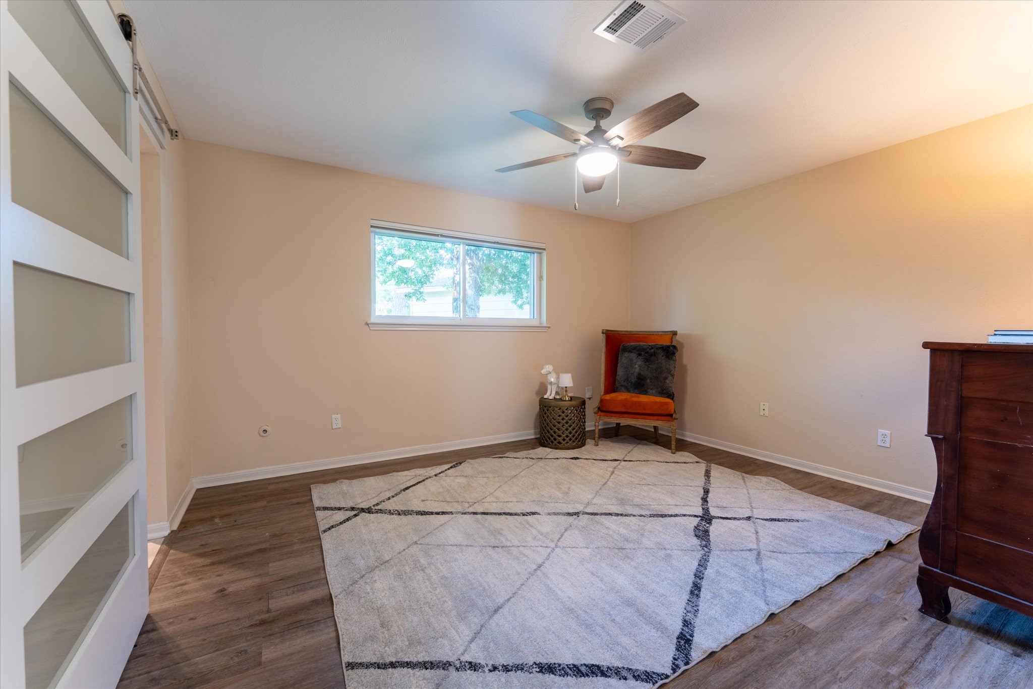 25019 Barmby Drive Spring, TX 77389 - Photo 36 of 43 a living room with furniture and a chandelier