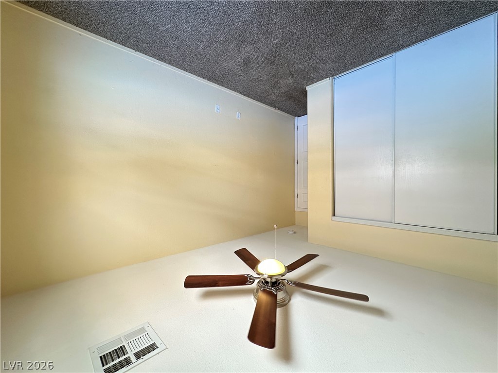 9032 Rutherford Grove Street Las Vegas, NV 89148 - Photo 16 of 24 A versatile room provides a comfortable space for quiet relaxation or productive work.