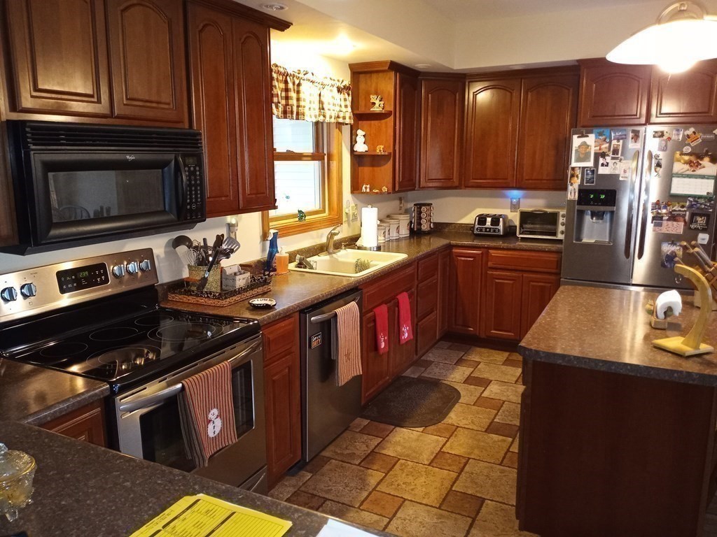 1753 White Pond Road Athol, MA 01331 - Photo 11 of 33 a kitchen with stainless steel appliances granite countertop a stove sink and cabinets