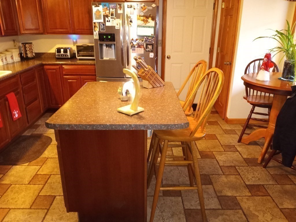 1753 White Pond Road Athol, MA 01331 - Photo 12 of 33 a kitchen with stainless steel appliances granite countertop a sink and a counter top space