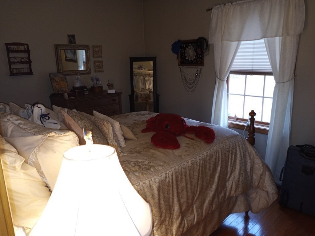 1753 White Pond Road Athol, MA 01331 - Photo 15 of 33 a bedroom with a bed and wooden floor