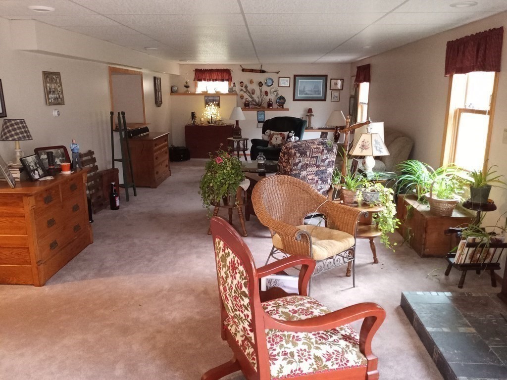 1753 White Pond Road Athol, MA 01331 - Photo 20 of 33 a living room with furniture a rug and a window