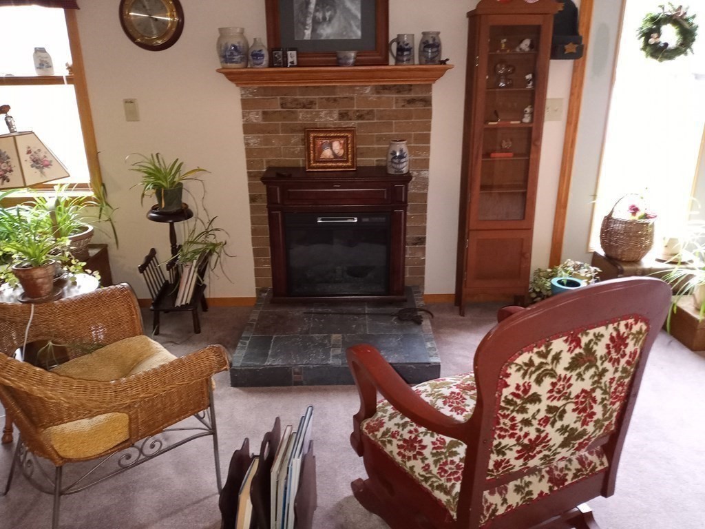 1753 White Pond Road Athol, MA 01331 - Photo 23 of 33 a living room with furniture a fireplace and a potted plant