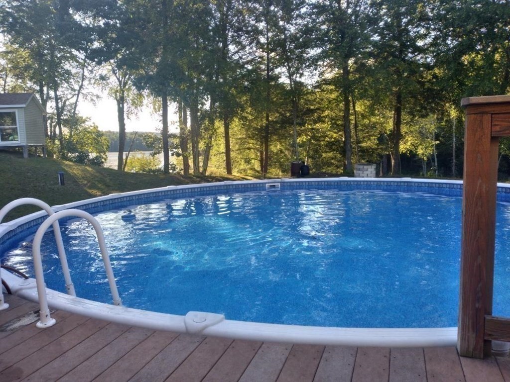 1753 White Pond Road Athol, MA 01331 - Photo 28 of 33 a view of a swimming pool with trees in the background