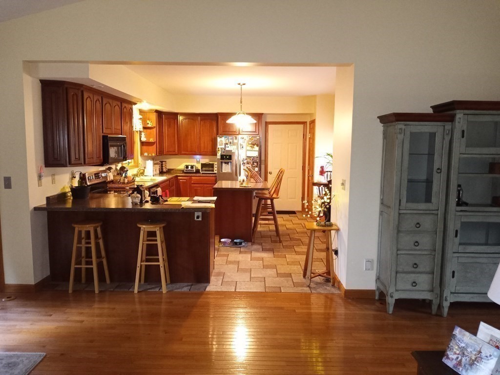 1753 White Pond Road Athol, MA 01331 - Photo 10 of 33 a view of a dining room with furniture window and wooden floor