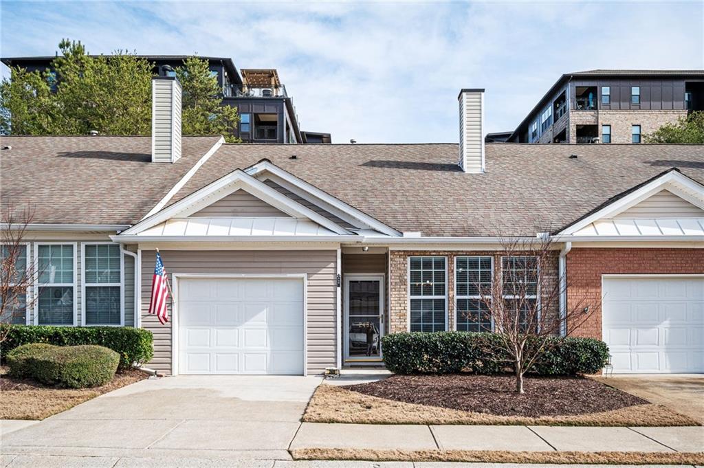 248 Riverstone Place Canton, GA 30114 - Photo 1 of 29 a front view of a house with garden