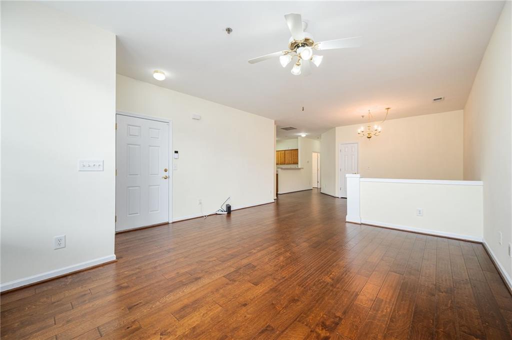 248 Riverstone Place Canton, GA 30114 - Photo 14 of 29 a view of an empty room with wooden floor