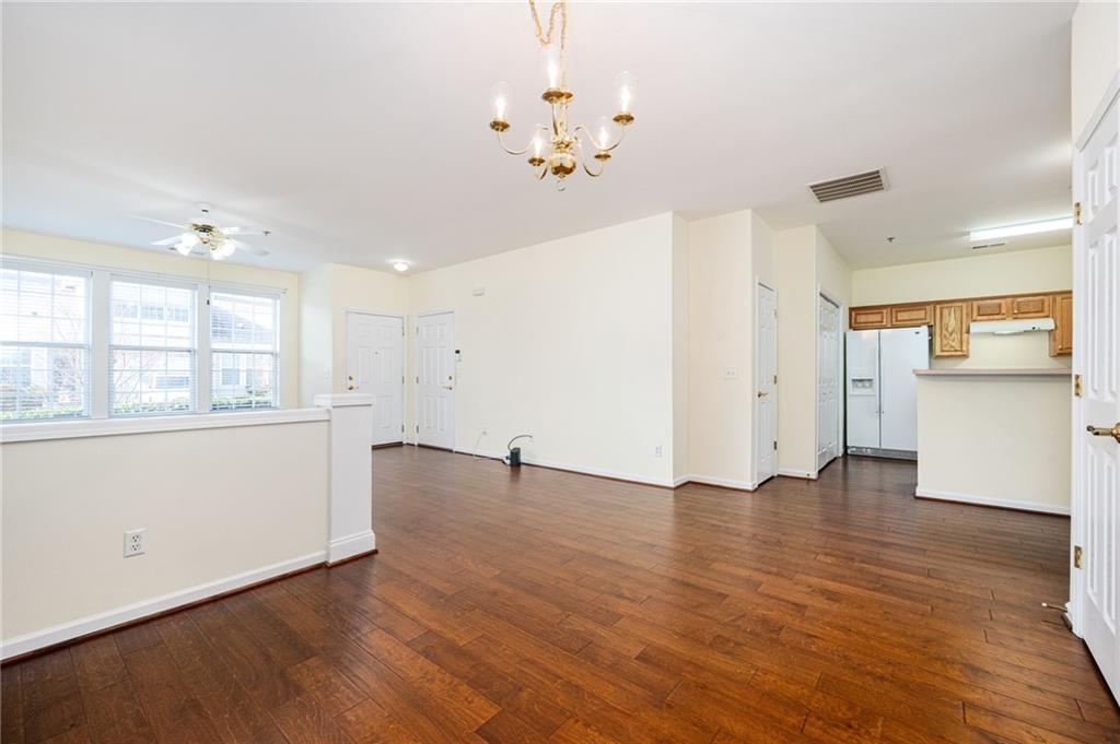 248 Riverstone Place Canton, GA 30114 - Photo 16 of 29 an empty room with wooden floor and windows