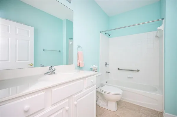 a bathroom with a sink a toilet and a bathtub