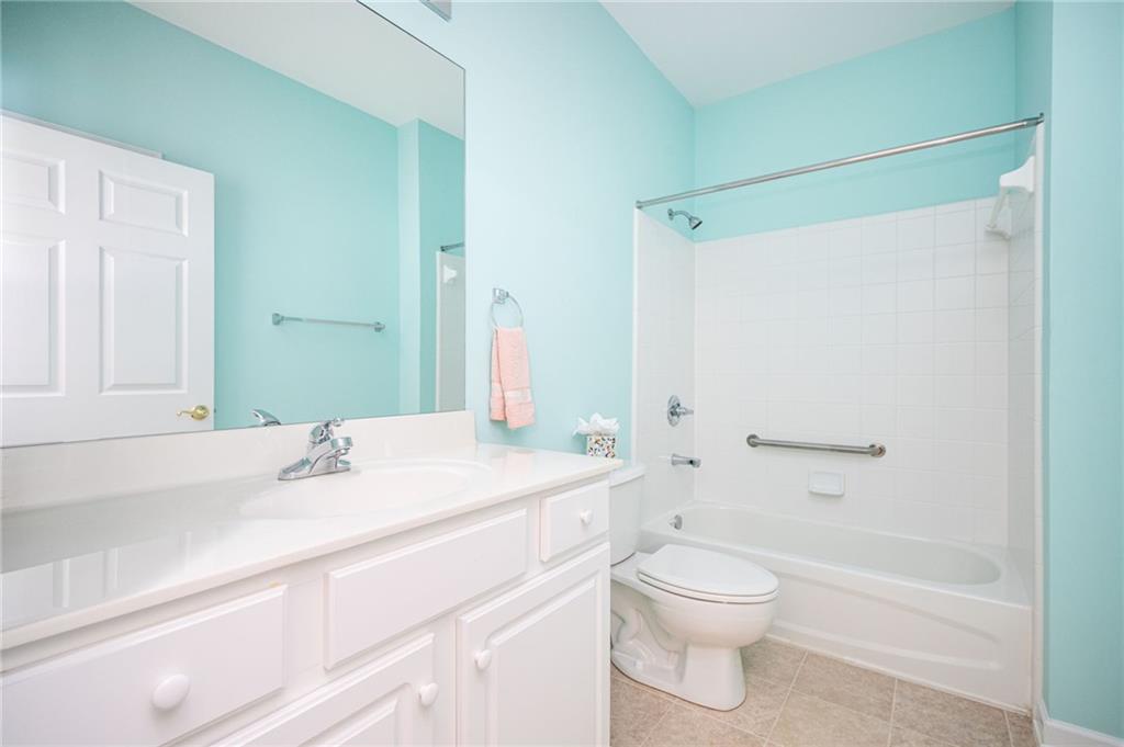 248 Riverstone Place Canton, GA 30114 - Photo 20 of 29 a bathroom with a sink a toilet and a bathtub