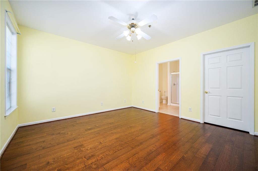 248 Riverstone Place Canton, GA 30114 - Photo 22 of 29 a view of an empty room with wooden floor