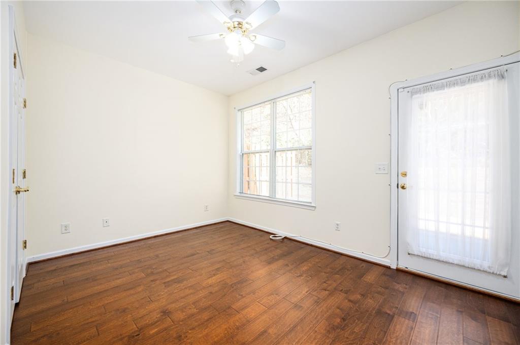 248 Riverstone Place Canton, GA 30114 - Photo 23 of 29 wooden floor in an empty room with a window