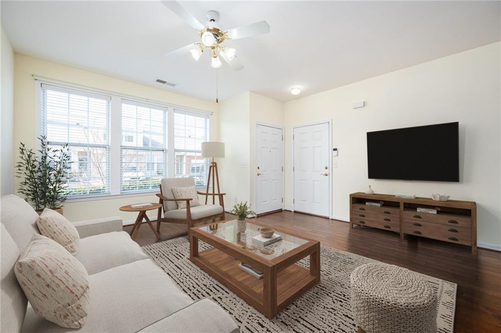 248 Riverstone Place Canton, GA 30114 - Photo 3 of 29 a living room with furniture and a flat screen tv