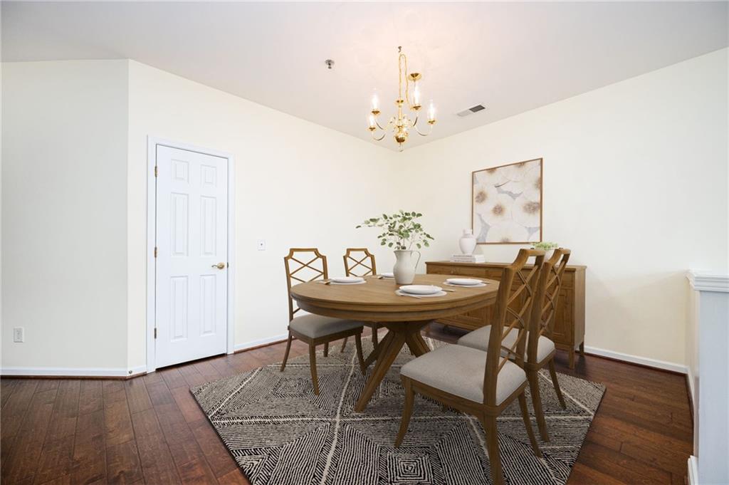 248 Riverstone Place Canton, GA 30114 - Photo 5 of 29 a view of a dining room with furniture and wooden floor