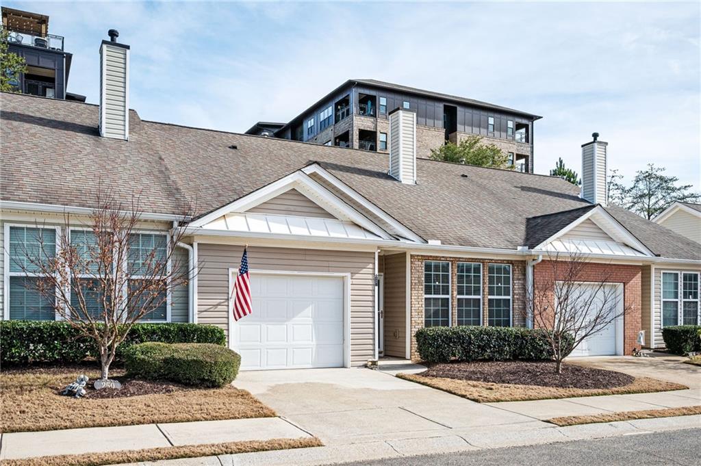 248 Riverstone Place Canton, GA 30114 - Photo 9 of 29 a front view of a house with a yard and potted plants