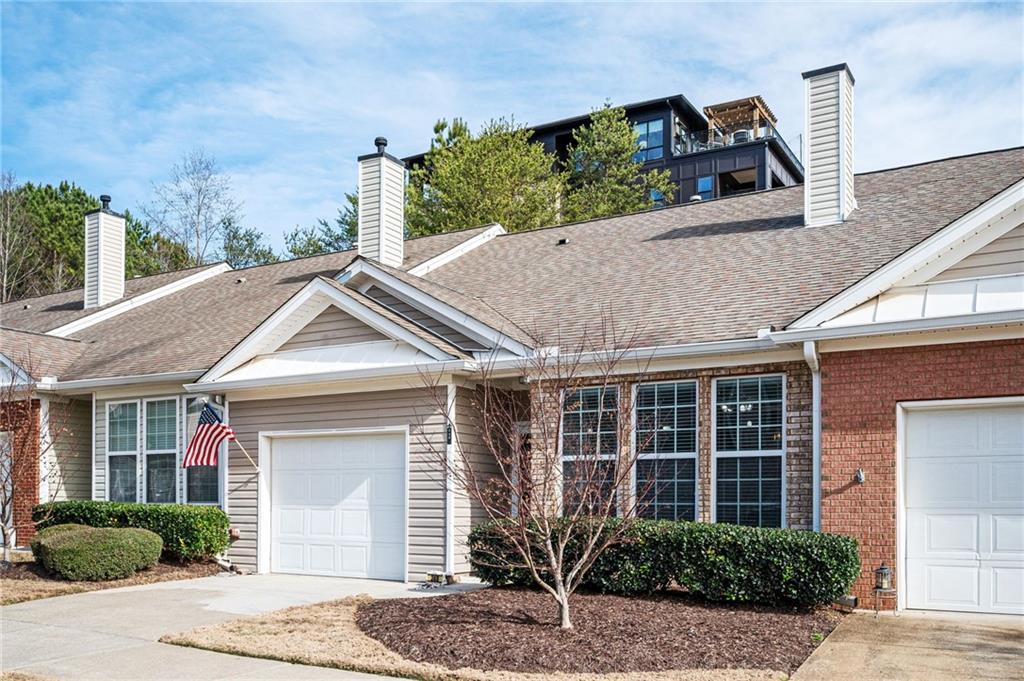 248 Riverstone Place Canton, GA 30114 - Photo 10 of 29 a front view of a house with a yard and potted plants