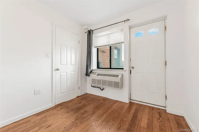 a room with a bed and a mirror