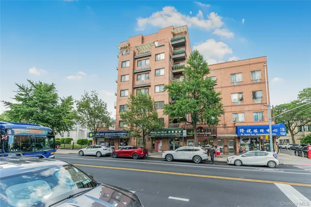 a view of a brick house with large windows