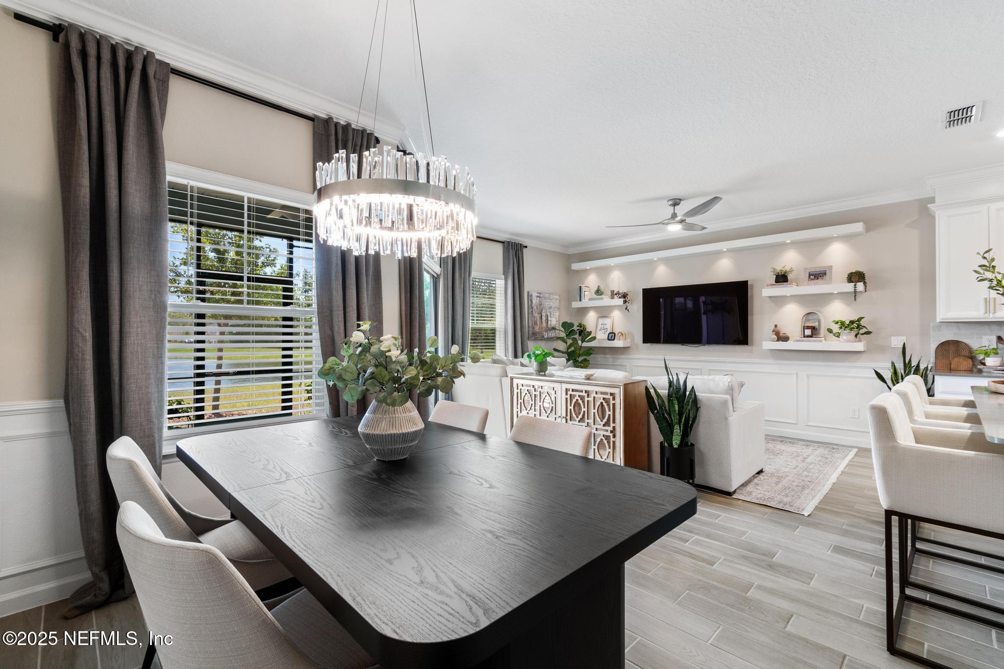 155 Appleton Court St. Augustine, FL 32092 - Photo 11 of 56 a view of a dining room with furniture and wooden floor