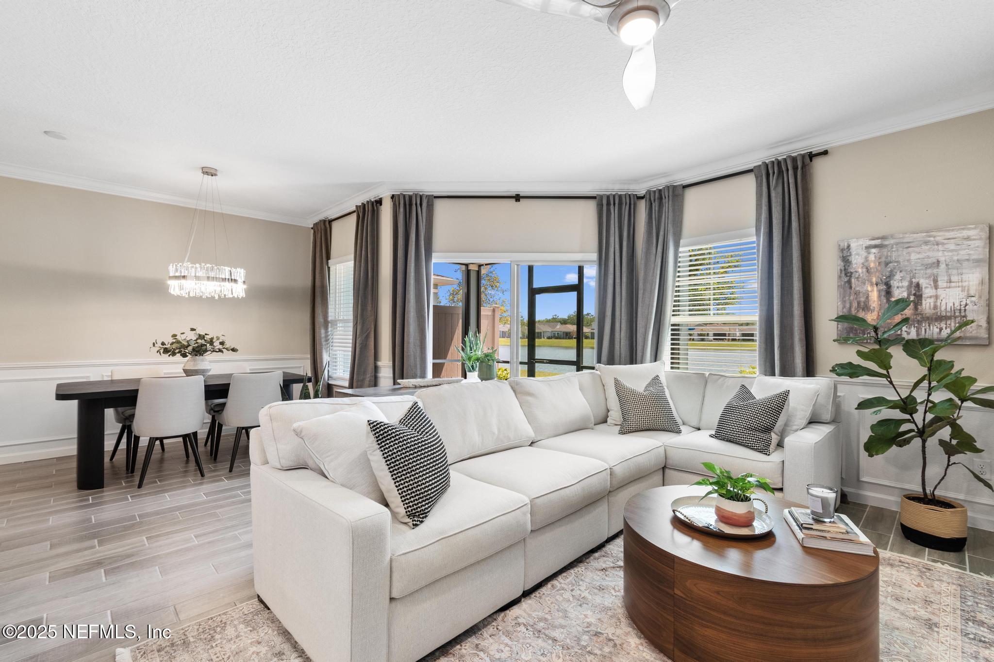 155 Appleton Court St. Augustine, FL 32092 - Photo 14 of 56 a living room with furniture potted plant and a window