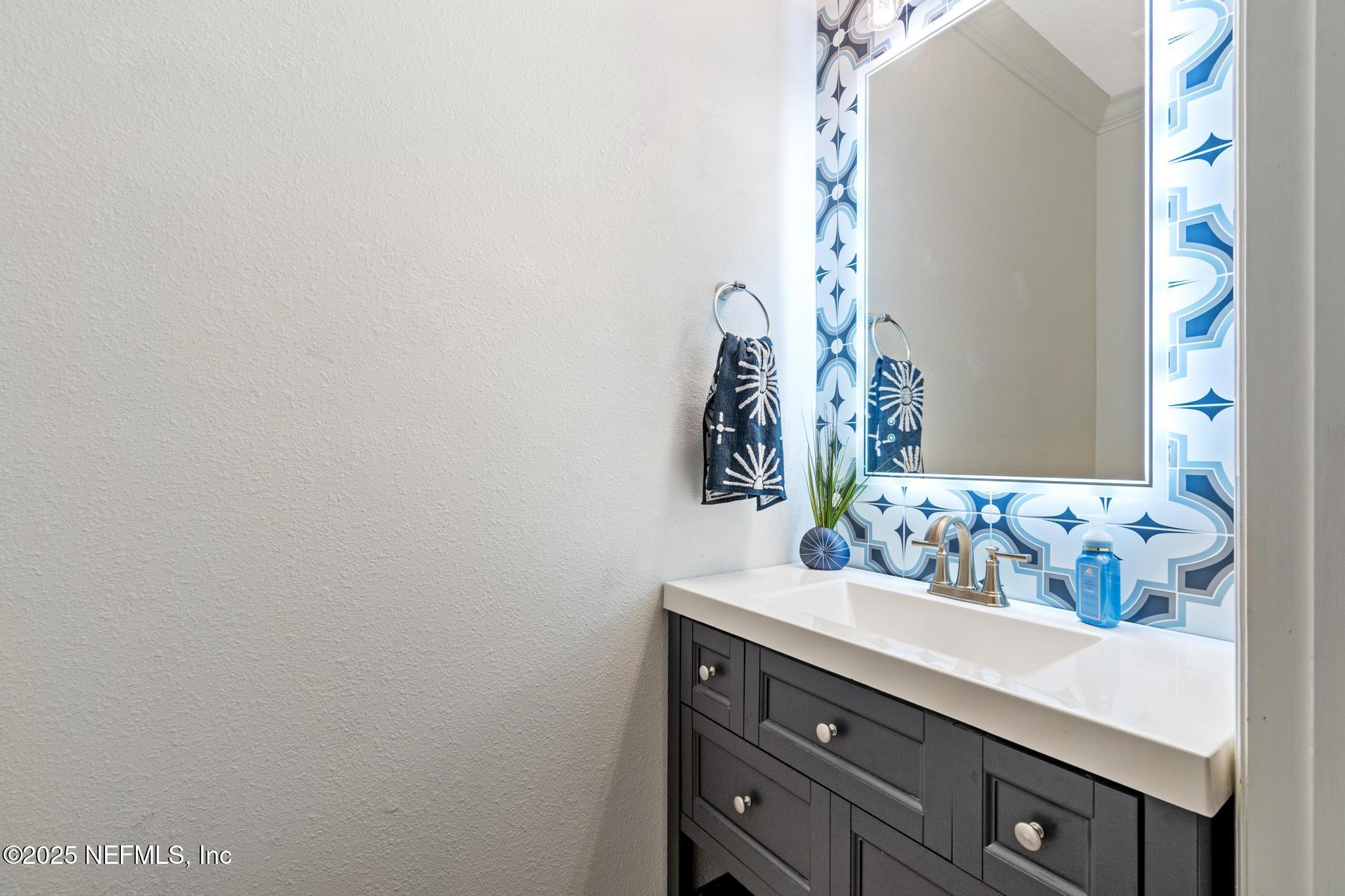 155 Appleton Court St. Augustine, FL 32092 - Photo 19 of 56 a bathroom with a sink and a mirror