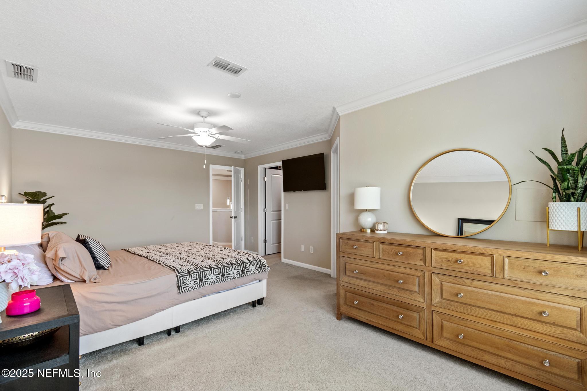 155 Appleton Court St. Augustine, FL 32092 - Photo 23 of 56 a bedroom with a bed and a dresser