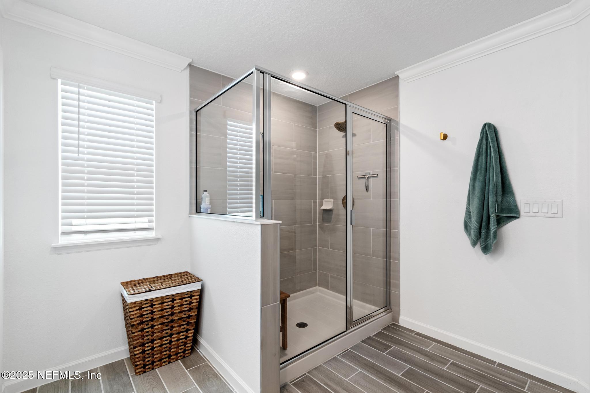 155 Appleton Court St. Augustine, FL 32092 - Photo 27 of 56 a bathroom with a shower and a chair