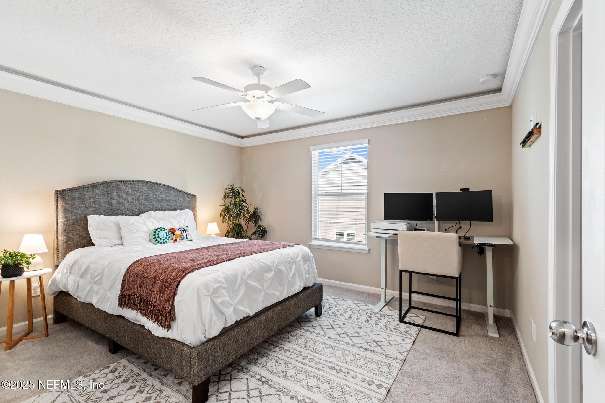 155 Appleton Court St. Augustine, FL 32092 - Photo 28 of 56 a bedroom with a bed and a desk
