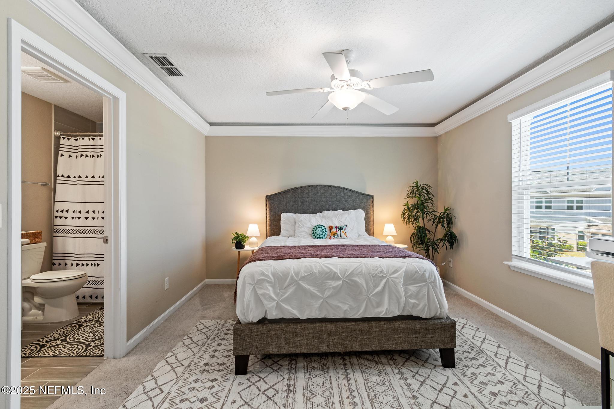 155 Appleton Court St. Augustine, FL 32092 - Photo 29 of 56 a bedroom with a bed and a window