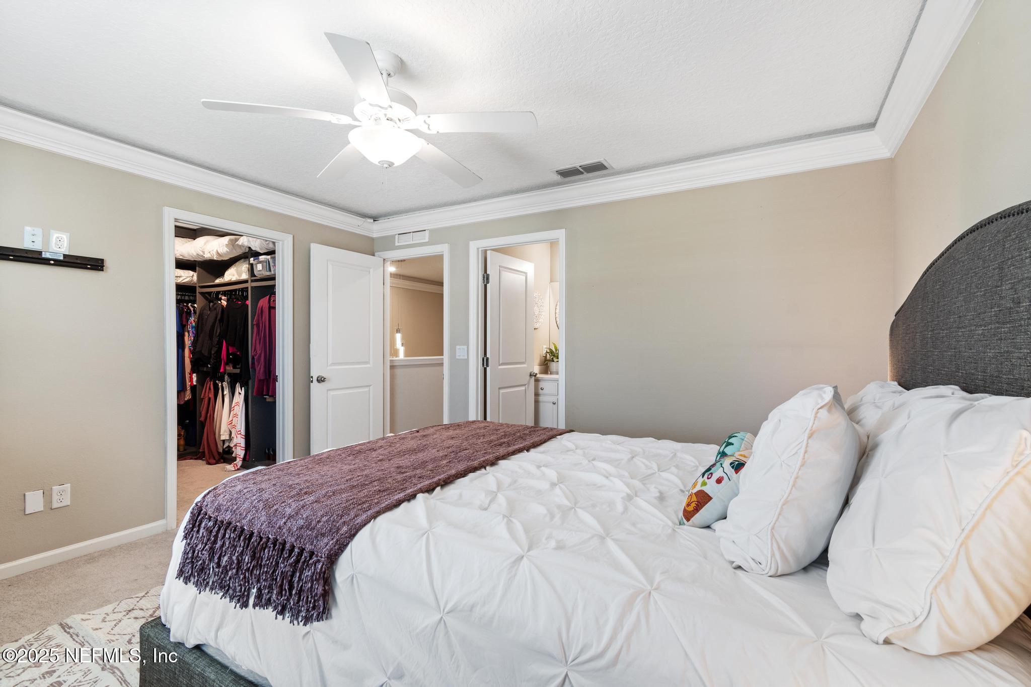 155 Appleton Court St. Augustine, FL 32092 - Photo 30 of 56 a view of a bedroom with a bed and a ceiling fan