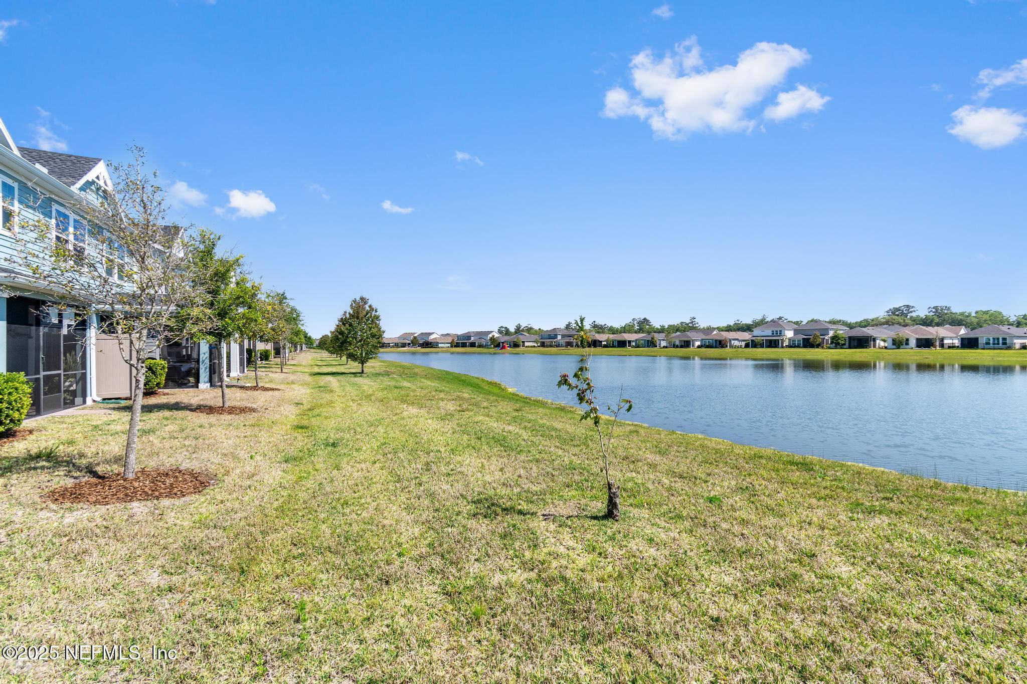 155 Appleton Court St. Augustine, FL 32092 - Photo 36 of 56 a view of a lake with a house in the background