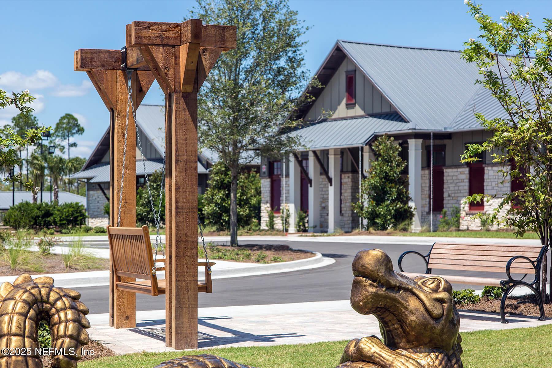 155 Appleton Court St. Augustine, FL 32092 - Photo 42 of 56 a view of a chair and tables in the patio and a fountain in the patio