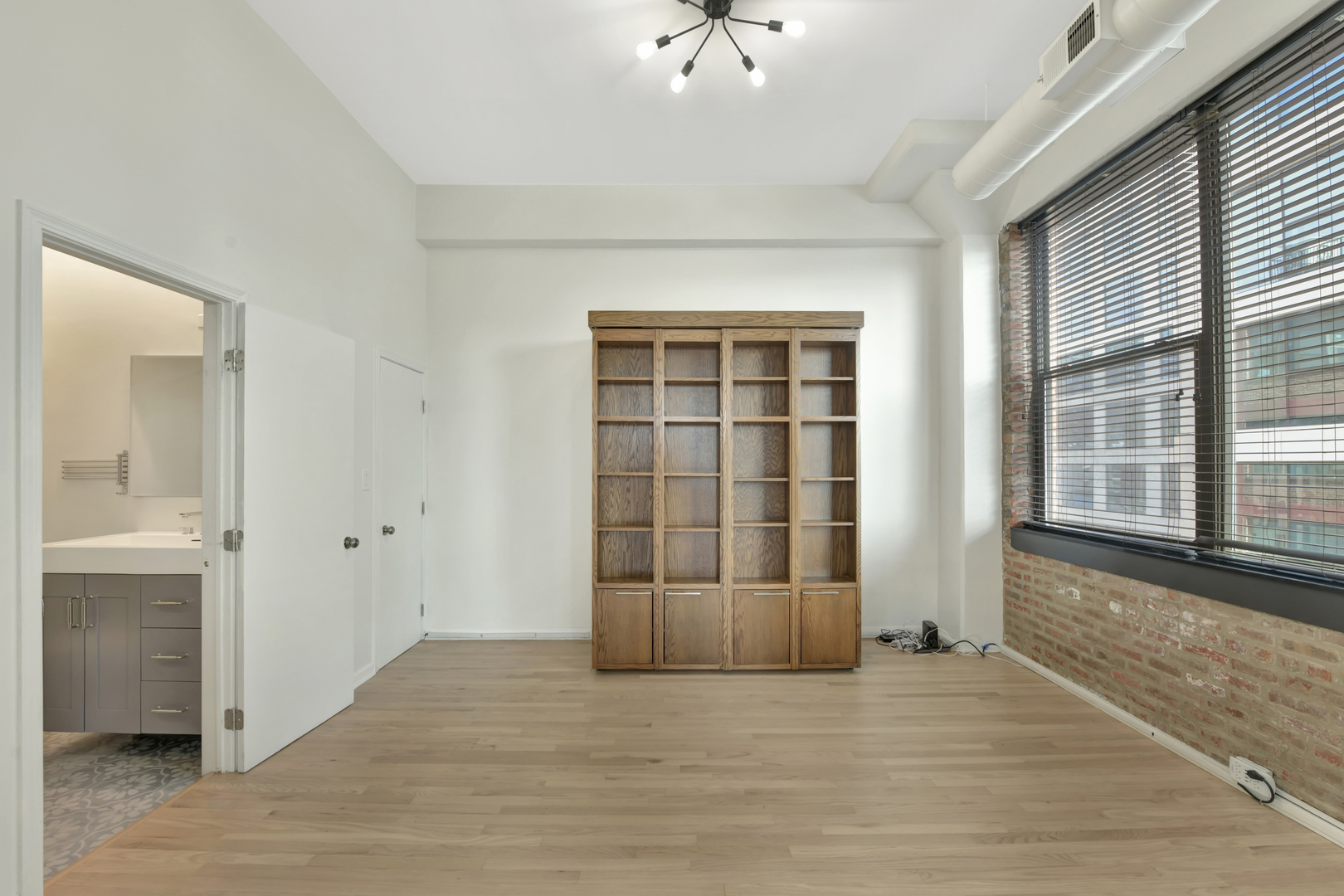 812 West Van Buren Street, Unit 5A Chicago, IL 60607 - Photo 17 of 26 wooden floor and windows in a room