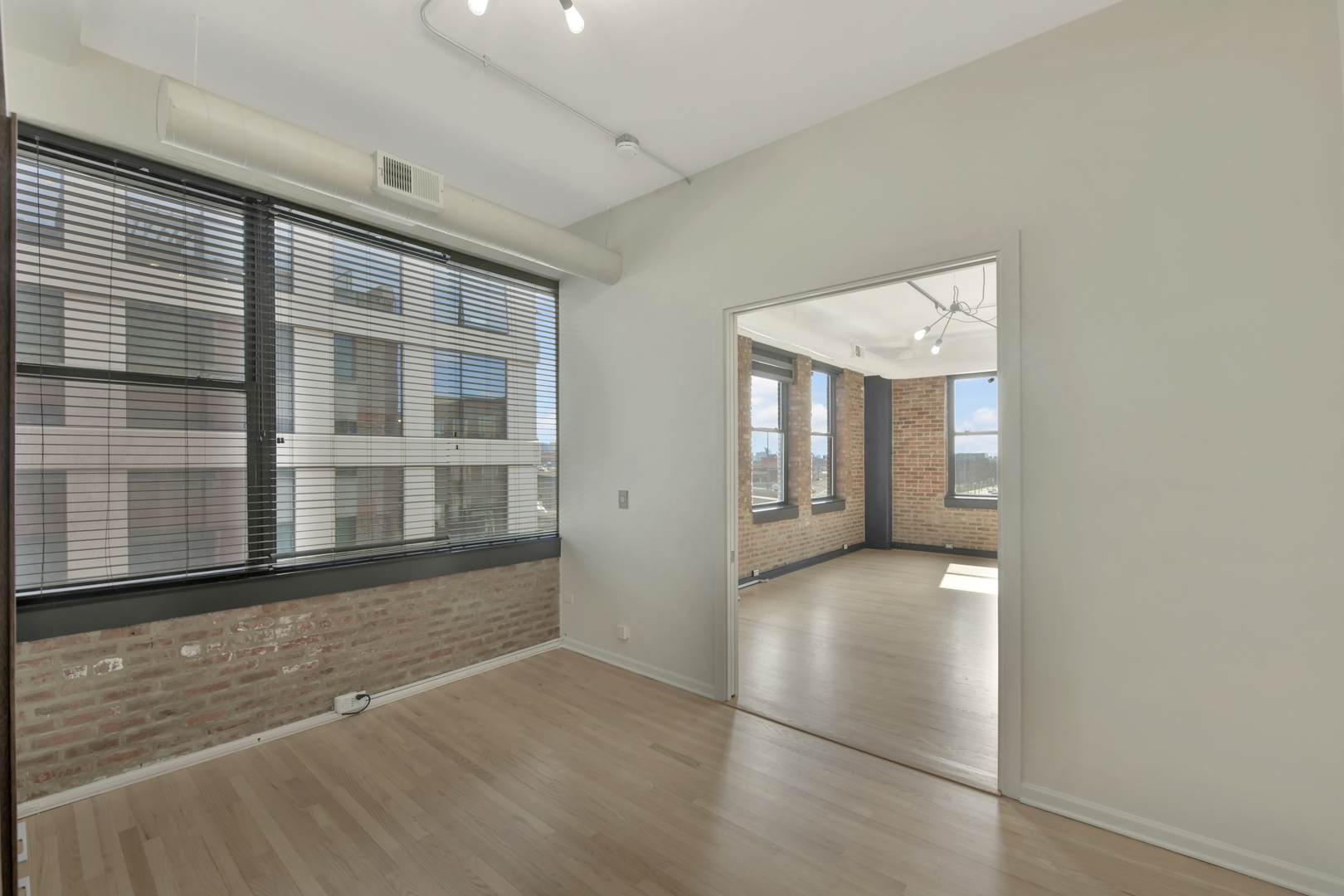 812 West Van Buren Street, Unit 5A Chicago, IL 60607 - Photo 18 of 26 an empty room with windows