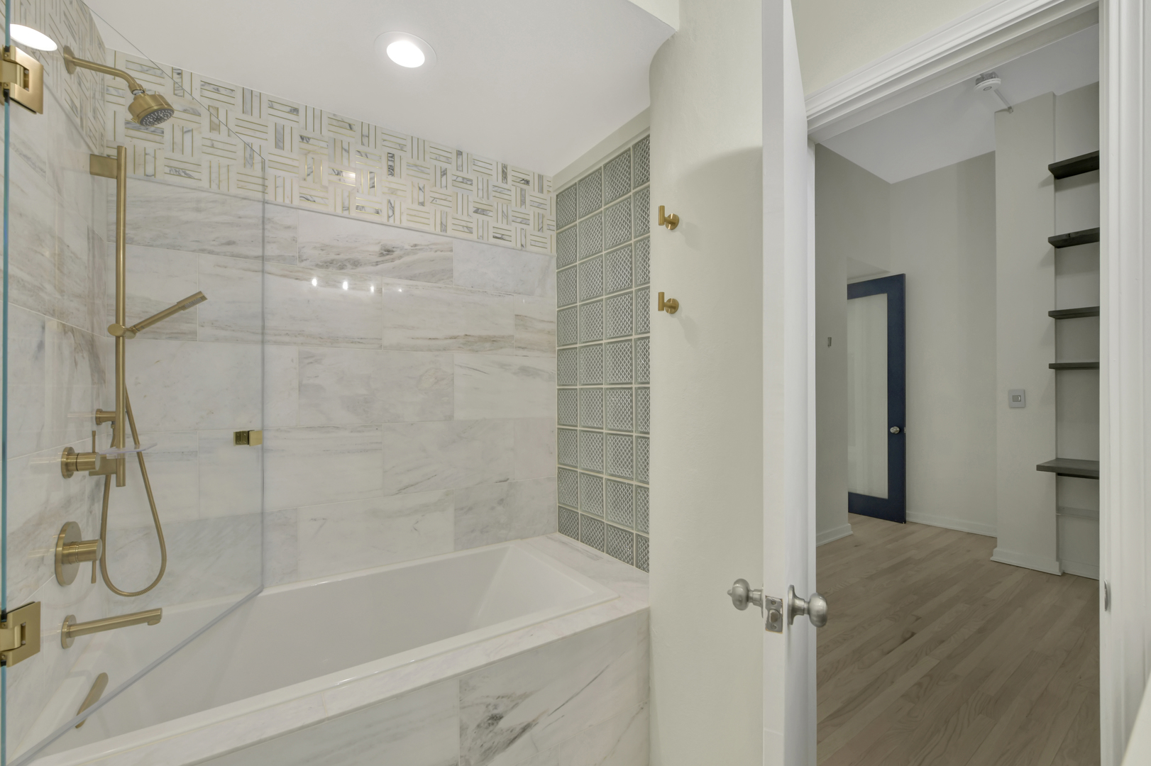 812 West Van Buren Street, Unit 5A Chicago, IL 60607 - Photo 22 of 26 a bathroom with a glass shower door