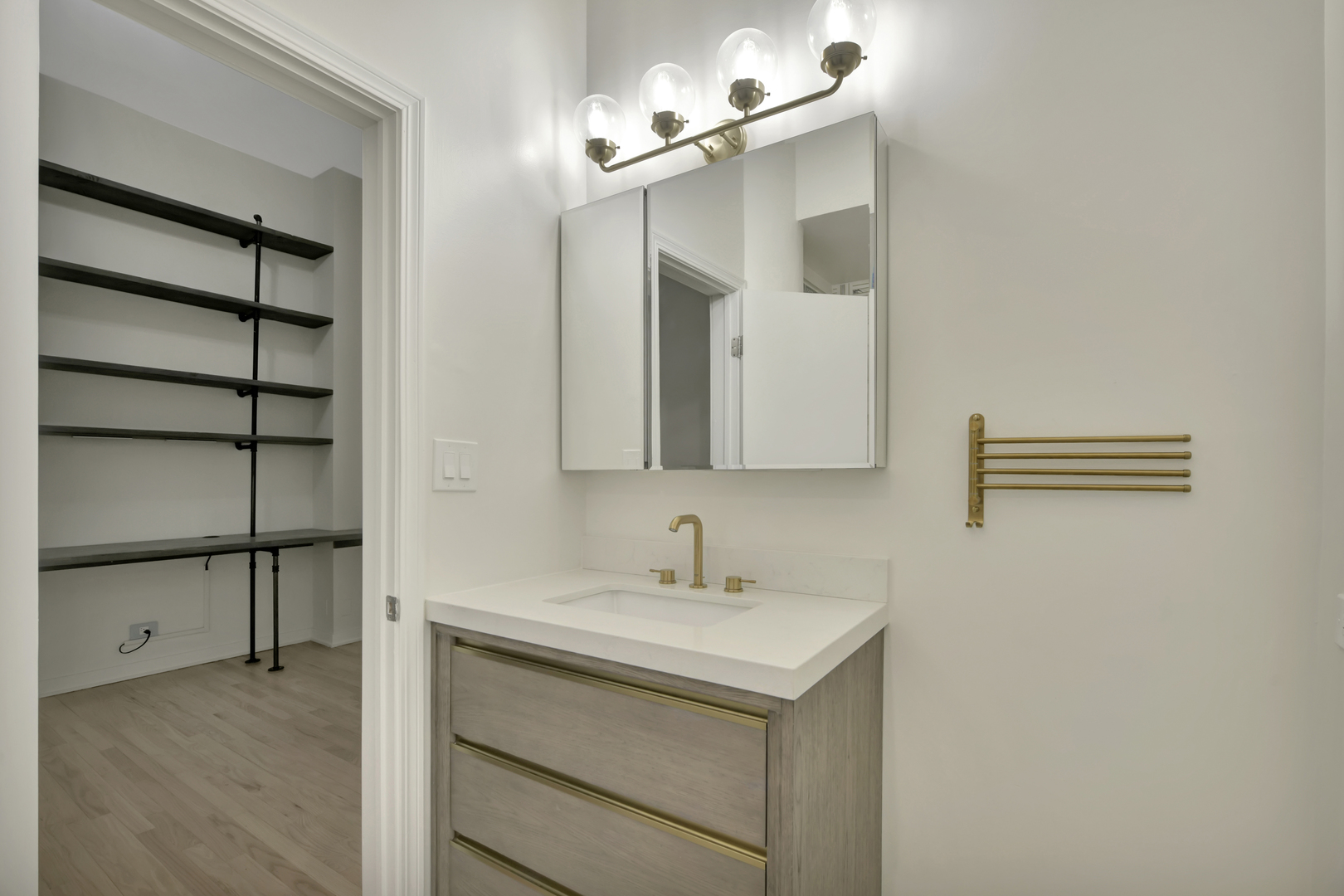812 West Van Buren Street, Unit 5A Chicago, IL 60607 - Photo 23 of 26 a bathroom with a sink and a mirror