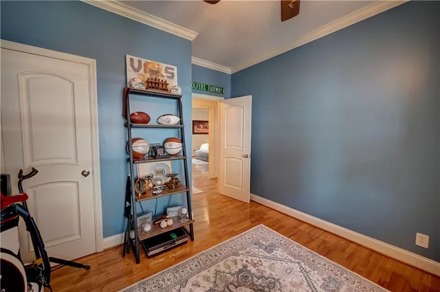 a view of backyard of house and car parked