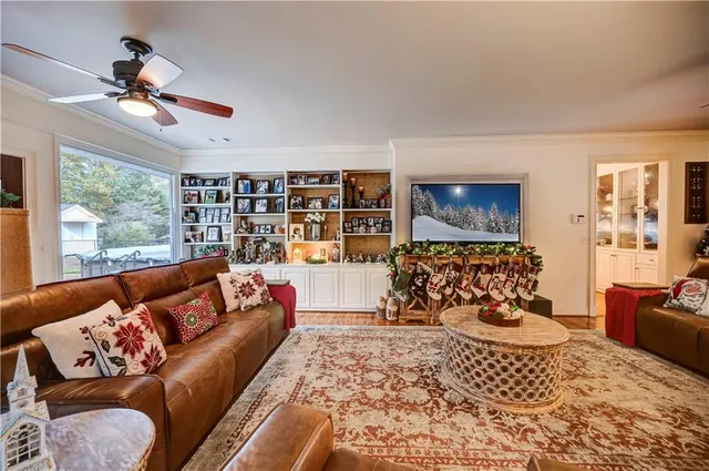 a kitchen with a table chairs refrigerator and microwave