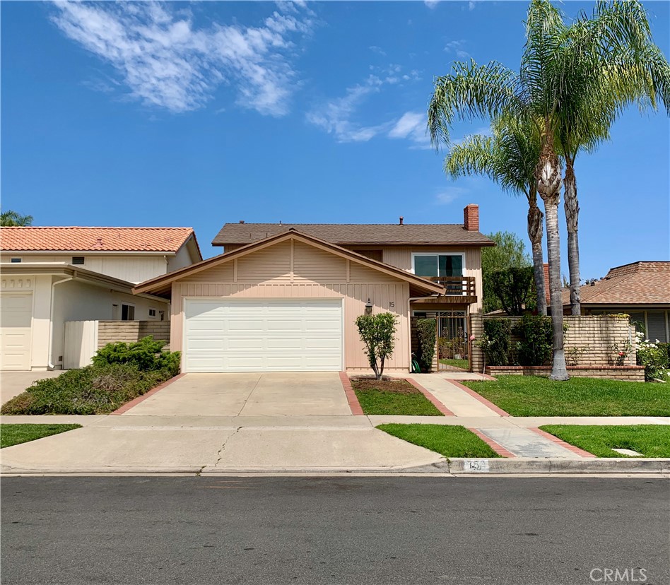 15 Butler Street Irvine, CA 92612 - Photo 1 of 37 a front view of a house with a yard and potted plants