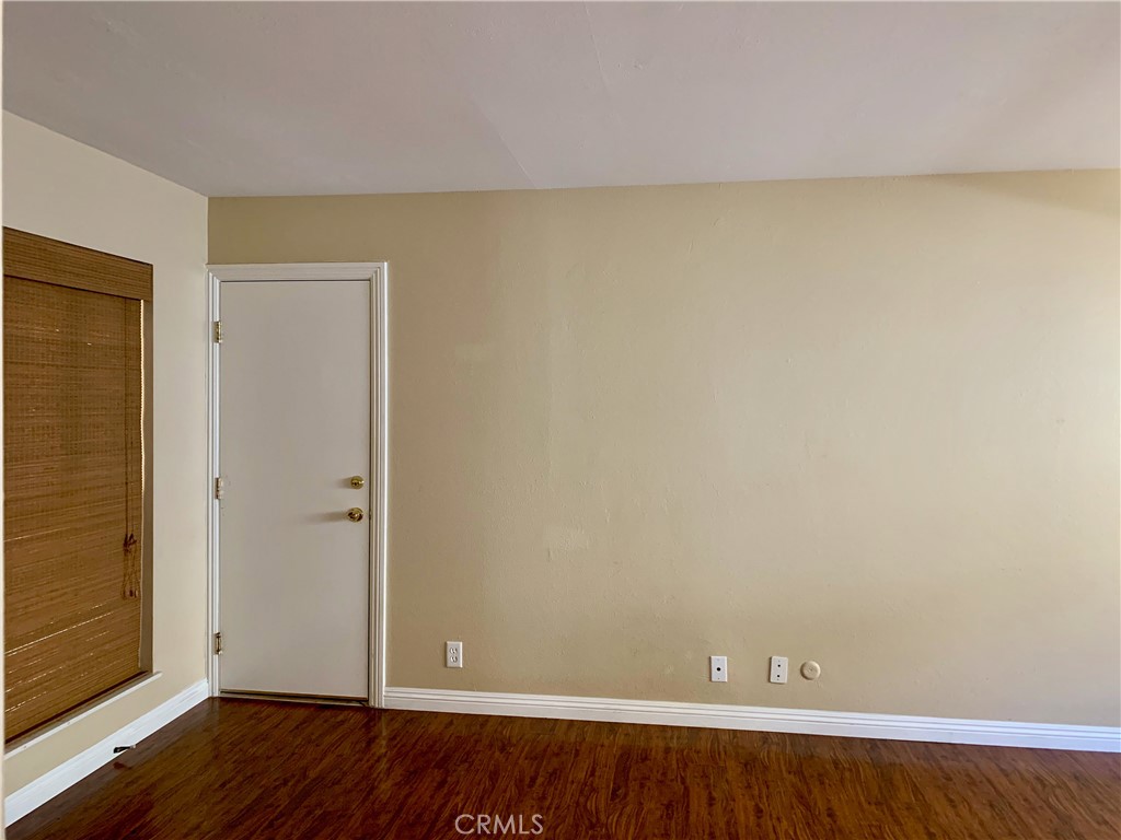 15 Butler Street Irvine, CA 92612 - Photo 15 of 37 an empty room with wooden floor