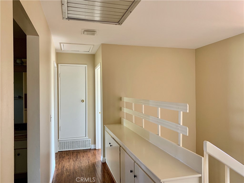 15 Butler Street Irvine, CA 92612 - Photo 21 of 37 a view of walk in closet with wooden floor