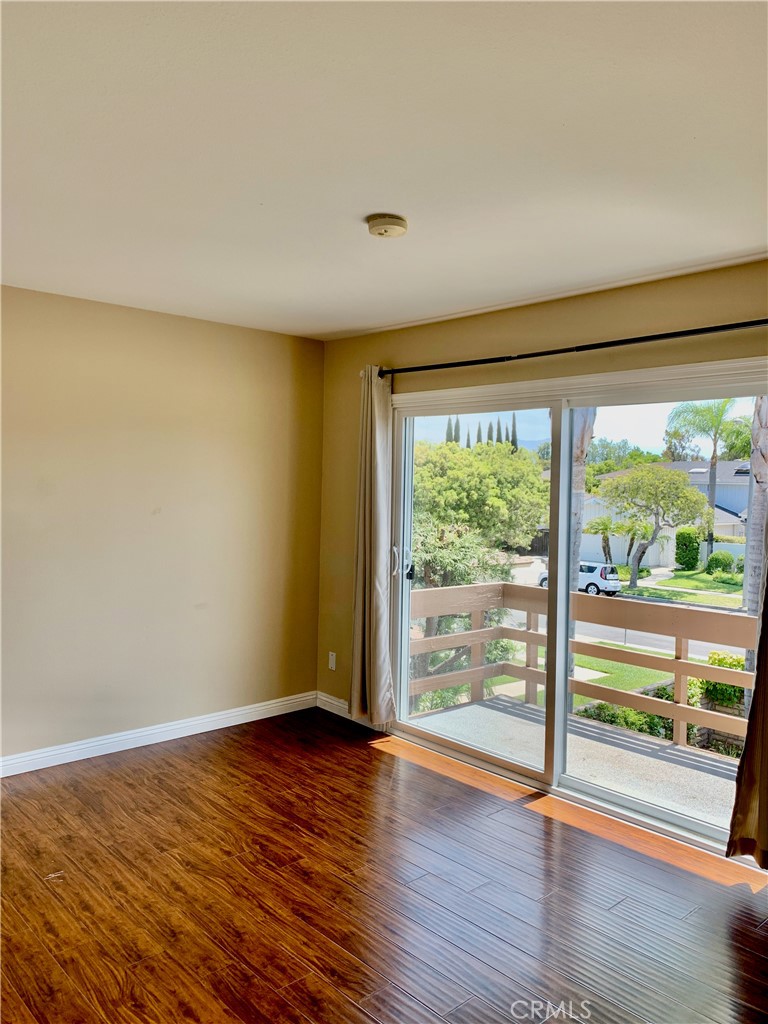 15 Butler Street Irvine, CA 92612 - Photo 23 of 37 a view of an empty room with wooden floor and a window