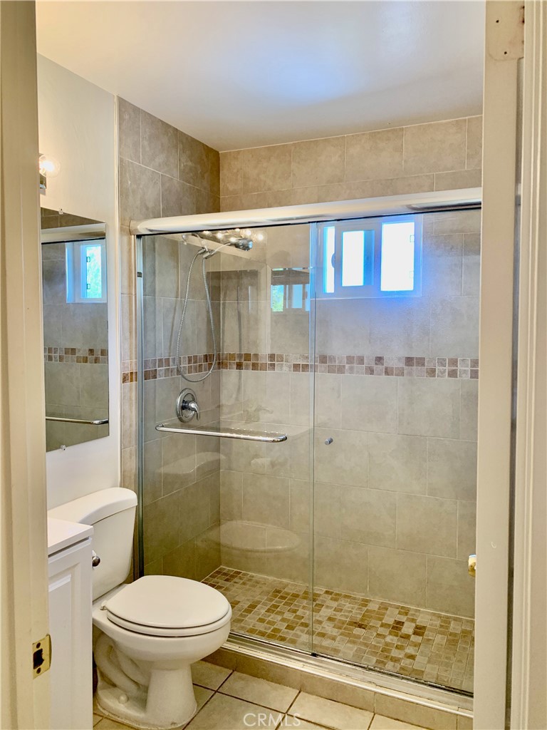 15 Butler Street Irvine, CA 92612 - Photo 25 of 37 a bathroom with a toilet and a shower