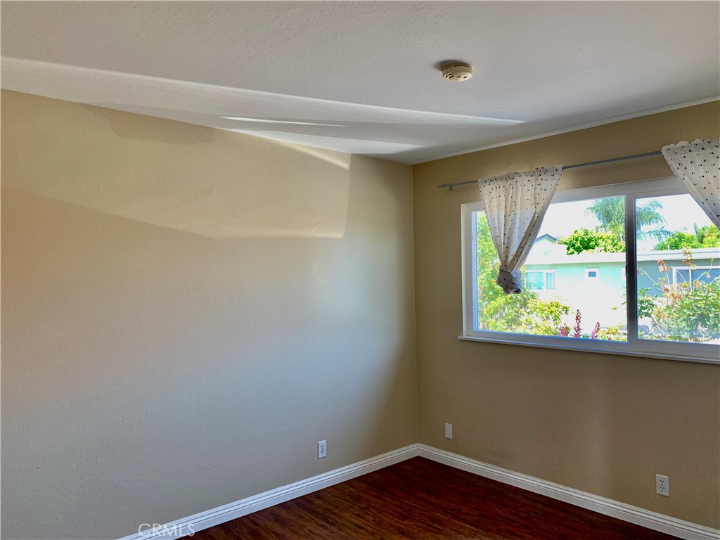 15 Butler Street Irvine, CA 92612 - Photo 27 of 37 a view of a small space with wooden floor and a window