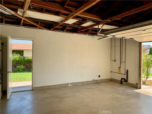 a view of a room with wooden walls