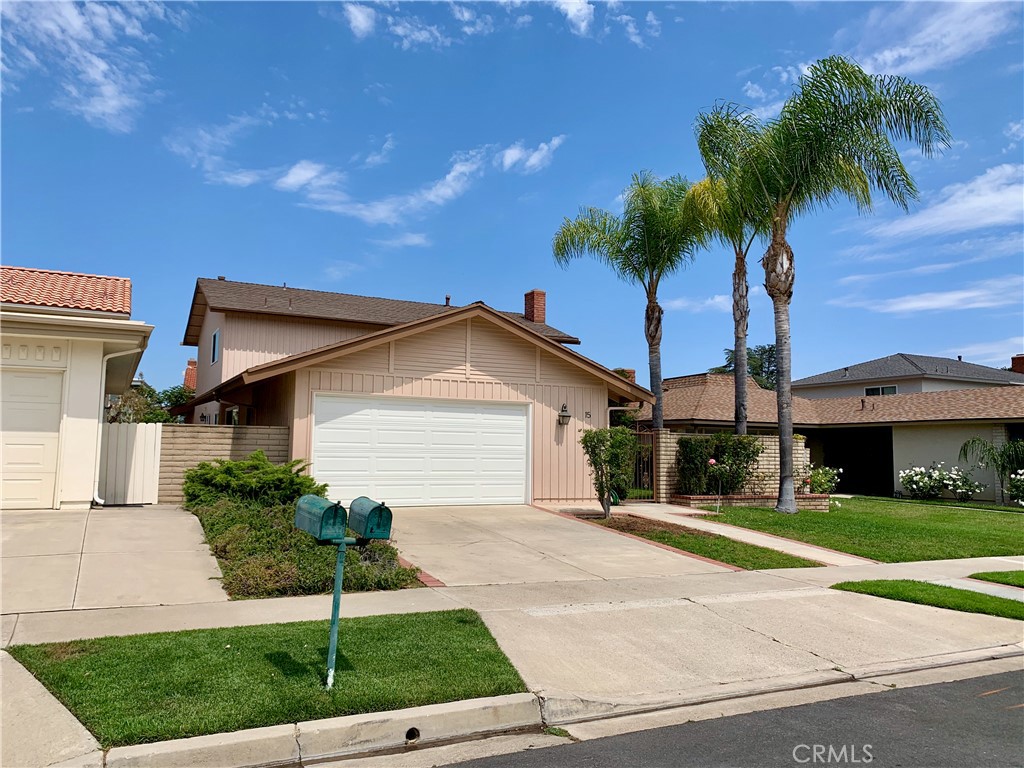 15 Butler Street Irvine, CA 92612 - Photo 37 of 37 a front view of a house with a yard and garage