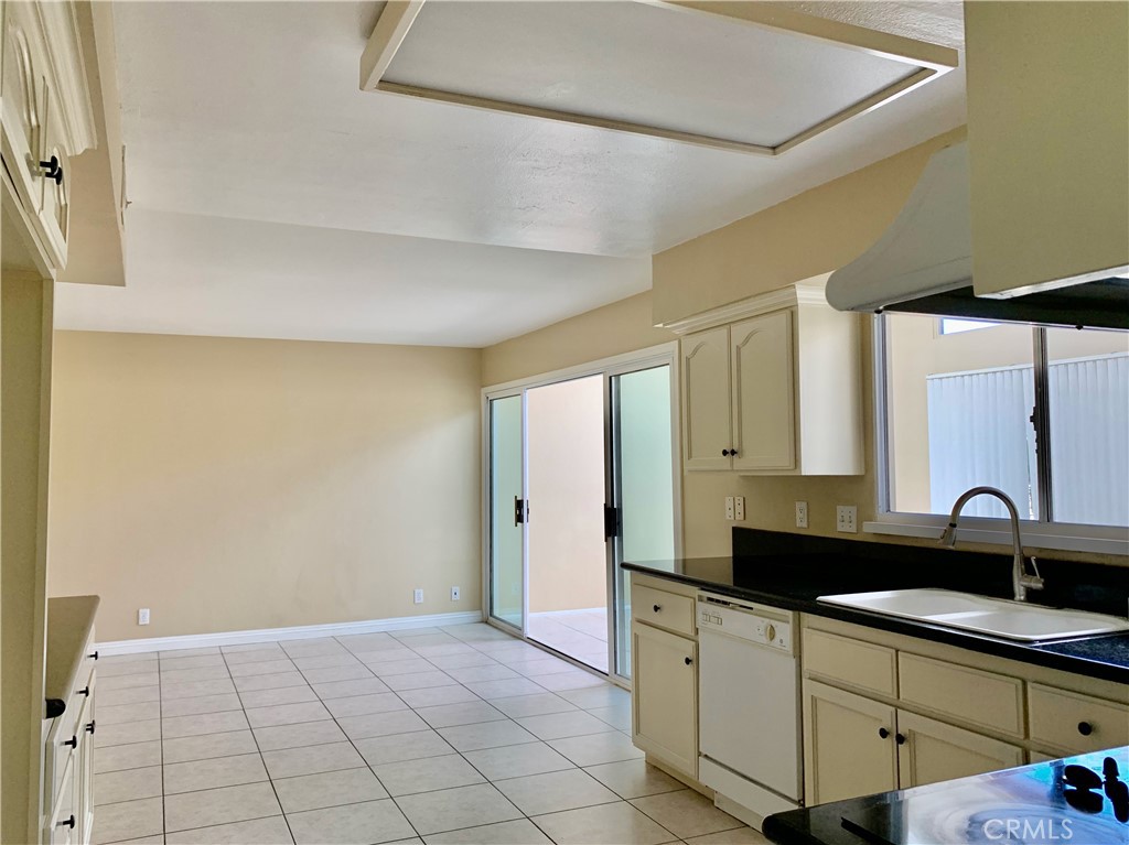 15 Butler Street Irvine, CA 92612 - Photo 9 of 37 a kitchen with a sink and cabinets