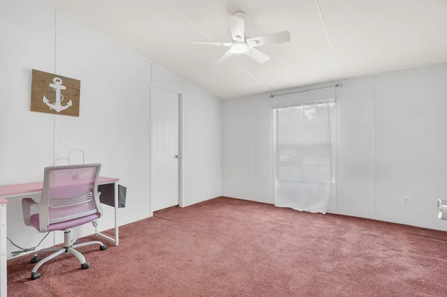 a view of workspace room with windows