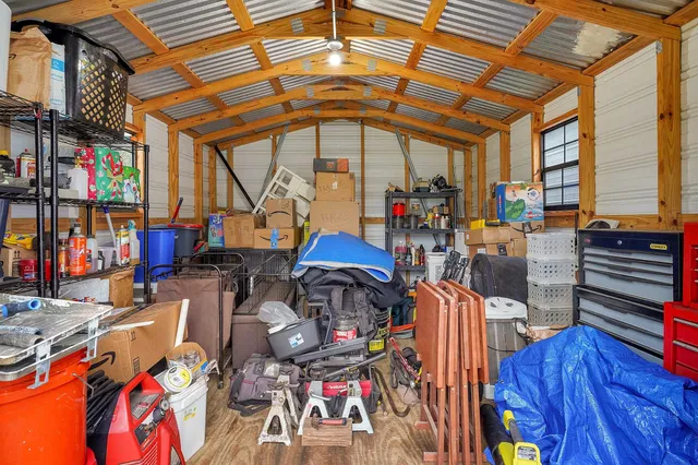 a view of a room with lots of furniture