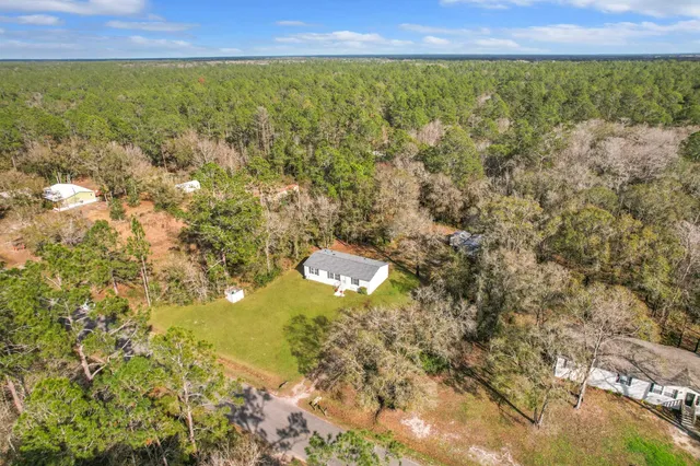 a view of a field with an ocean